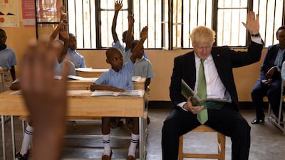British Prime Minister Boris Johnson attends a lesson during a visit to GS Kacyiru II school, on the sidelines of the Commonwealth Heads of Government Meeting in Kigali, Rwanda. Reuters
