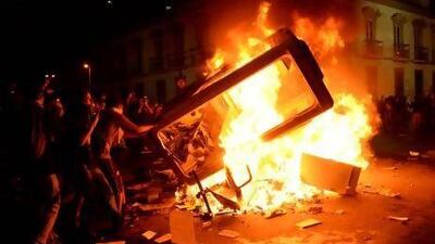 Vandals set a booth and other objects on fire during clashes in Rio de Janeiro.