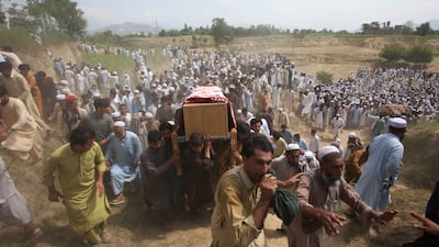 People carry the coffins of victims of a suicide a blast in the Bajaur district of Pakistan's Khyber Pakhtunkhwa province. Reuters