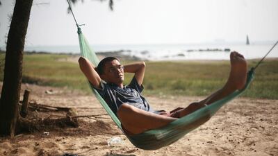 Lin Dong, founder of China's first association of private island owners, relaxing on his private island off the coast of southern China's Guangxi region. AFP PHOTO