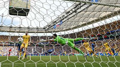 Romania goalkeeper Florin Nita is beaten by Ondrej Duda's header that put Slovaka 1-0 up. AFP
