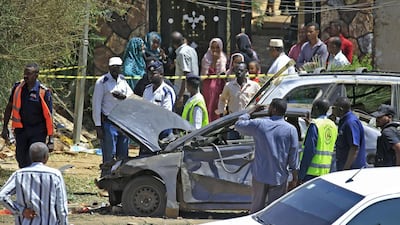 Sudanese rescue teams and security forces gather next to damaged vehicles at the site of an assassination attempt against Sudan's Prime Minister Abdalla Hamdok, who survived the attack with explosives unharmed, in the capital Khartoum. AFP