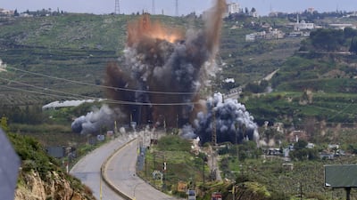 Smoke and flames rise after an Israeli strike on the Qasmiya Bridge near Tyre, in southern Lebanon. EPA