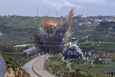Smoke and flames rise after an Israeli air strike on the Qasmieh Bridge near Tyre, in southern Lebanon. EPA