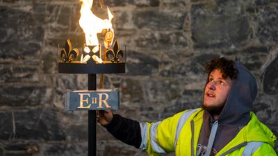 Lewis Wilde tests one of the gas-fuelled beacons he has made at the Fountain Designs workshop in Selkirk, in the Scottish Borders, on March 9. They will be used to signal the start of British Queen Elizabeth II's platinum jubilee in June. PA