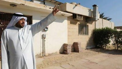 Abdullah Mohammed, a retired Arabic teacher, stands in front of his house in Ahmadi yesterday. He says residents are “nervous because this situation is very dangerous”.