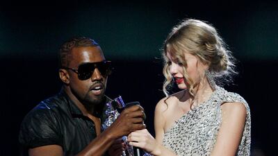 West takes the mic from singer Taylor Swift as she accepts an MTV Video Music Award 2009. He said Beyonce should have won instead. AP Photo