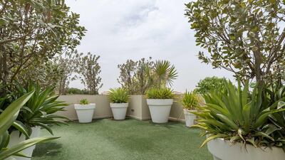 The rood terrace is in keeping with the landscaped setting. Courtesy LuxuryProperty.com