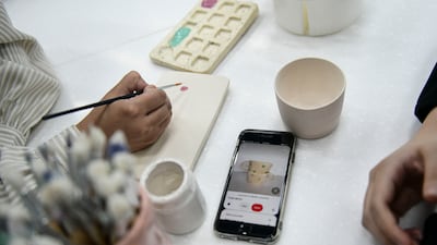 Several customers bring an image on their phone of the piece they want to create.