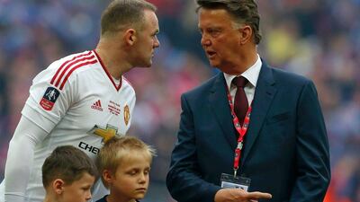 Wayne Rooney, left, talks with Louis van Gaal before Manchester United's FA Cup final match against Crystal Palace. Ian Kington / AFP