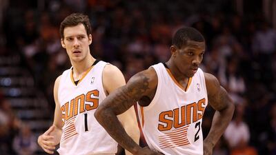 Goran Dragic, left, and Eric Bledsoe are two of the reasons the Phoenix Suns have risen to the top of the NBA's Western Conference. Christian Petersen / AFP