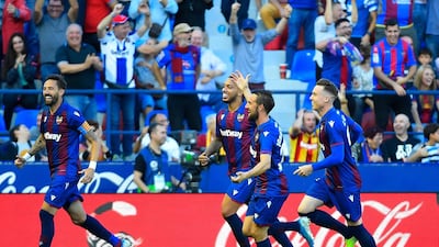 Levante's players celebrate their third goal scored against Barcelona at the Ciutat de Valencia Stadium. AFP