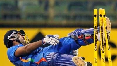 Indian batsman Virat Kohli collapses after being run out for 77 runs.