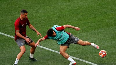 Dejan Lovren, left, looks to tackle Mohamed Salah. EPA