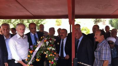 A photo posted on the Facebook page by Palestinian Embassy in Tunisia of Jeremy Corbyn attending a wreath-laying ceremony in front of a plaque honouring the founder of Black September on October 14, 2014. Facebook