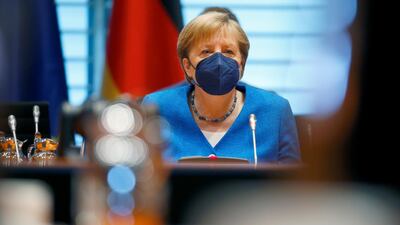 German Chancellor Angela Merkel wears a mask ahead of the weekly cabinet meeting at the Chancellery in Berlin. Reuters