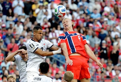Norway's Erling Haaland, right, in action with Iraq's Ali Al Hamadi. Reuters