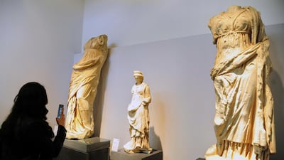 A visitor takes photos during the reopening ceremony for Syria's National Museum, in Damascus, Syria, Sunday, Oct. 28, 2018. Photo / SANA via AP