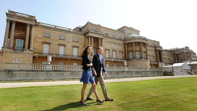 Prince William and Catherine outside Buckingham Palace the day after their wedding where a helicopter was waiting to fly them off on honeymoon
