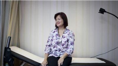 Efipania Balala, 49, poses for a portrait at the American European Medical Center. Efipania was diagnosed with colorectal cancer and has since had surgery to remove the tumor. Razan Alzayani / The National