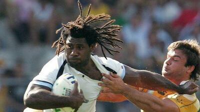 Fiji's centre Seru Rabeni, left, died on March 15, 2016 at the age of just 37, rugby officials in the Pacific nation said, prompting shock and tributes from the well-travelled players' teammates and fans. AFP / ANNE-CHRISTINE POUJOULAT