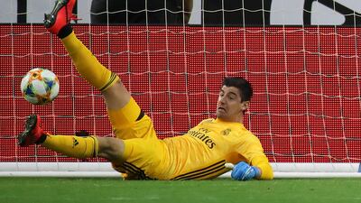 Real keeper Thibaut Courtois makes a save. Reuters