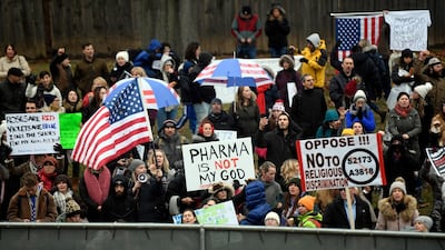 Anti-vaccine protesters gather outside the New Jersey State House in the US, but such scepticism towards jabs represents a global public health issue. USA Today Network
