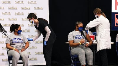 Students from Suffolk County Community College prepare to get vaccinated during a news conference at the school in Brentwood, New York. Several colleges in the state announced the cancellation of vaccination clinics using the Johnson & Johnson vaccine. AP Photo