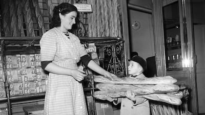 A little boy buys baguettes as Parisians stock up on bread for two days in preparation for a bakers' strike in Paris in 1949. AFP