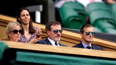Bear Grylls (right) in the Royal Box on centre court on day four of Wimbledon at The All England Lawn Tennis and Croquet Club, Wimbledon.