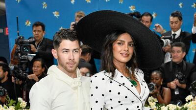 Nick Jonas and Priyanka Chopra wear looks by Olivier Rousteing. AP