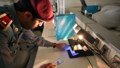 Currency is tested at the Forensic Science Department in Abu Dhabi on Jan 6 2009.