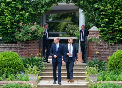 Princes William and Harry unveil a statue they commissioned of their mother Diana, Princess of Wales, in the Sunken Garden at Kensington Palace, in 2021. Getty Images