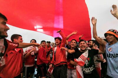 Fans of River Plate celebrate at the Puerta del Sol square in Madrid after the team won the all-Argentine Copa Libertadores final against Boca Juniors at the Santiago Bernabeu stadium, on December 9, 2018. / AFP / RAGGIO ALBERTO