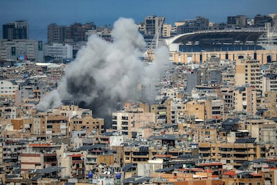 Smoke rises from the site of an Israeli strike on Beirut's southern suburbs, near Camille Chamoun Sports City Stadium, part of a sustained wave of attacks. AFP
