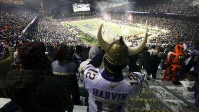 Fans cheer as the Minnesota Vikings take to the field at TCF Bank Stadium for their first outdoor game in 29 years.