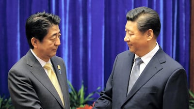 China's President Xi Jinping (R) and Japan's Prime Minister Shinzo Abe. The two countries are competing for Asian economic dominance. Kim Kyung-Hoon / AFP