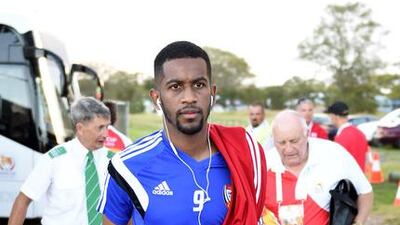 Defender Abdulaziz Haikal listens to music on the way to training.