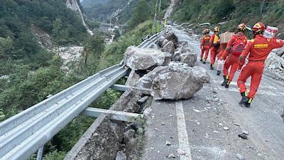 Rescuers head into Luding county after the earthquake. EPA
