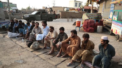 People, who fled a prison after a militant attack, sit on the ground after they were captured by Afghan security officials in Jalalabad, Afghanistan. EPA