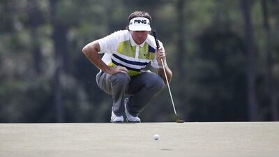 Bubba Watson lines up his putt on the 18th hole during the second round of the 2014 Masters Tournament at Augusta National in Augusta, Georgia, USA, on Friday. Tannen Maury / EPA / April 11, 2014