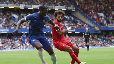 Chelsea goalscorer Axel Disasi, left, challenges Liverpool's Mohamed Salah in the Premier League clash at Stamford Bridge on Sunday, August 13, 2023. AP
