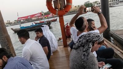 Tourists enjoy using the abras for alternative views of the city