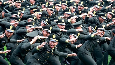 Newly inaugurated military officers celebrate at a ceremony outside the Presidential Palace in Jakarta, Indonesia. EPA