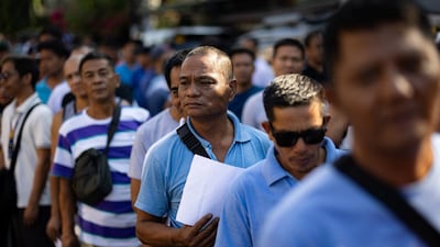 Jeepney drivers queue to receive cash handouts from the Philippines government amid rising fuel prices in Manila. Reuters
