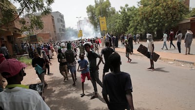 Protesters clash with security forces as they fire tear gas to prevent them from marching towards the presidential palace during demonstrations demanding civilian rule, in Khartoum, Sudan, May 19, 2022. AP Photo