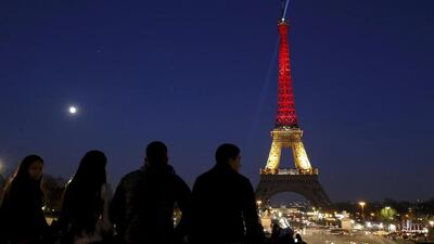 The Eiffel Tower is seen with the black, yellow and red colours of the Belgian flag in tribute to the victims of today’s Brussels bomb attacks, in Paris. Philippe Wojazer / Reuters