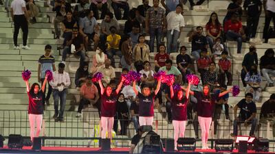 Cheerleaders perform at the match.