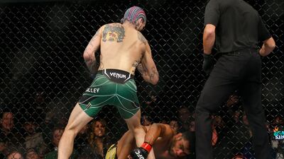 Sean O'Malley, left, defeats Raulian Paiva via TKO during a bantamweight bout at UFC 269. AP Photo