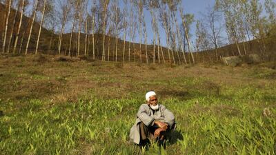 A Kashmiri Muslim sits at a graveyard during the funeral of Ghulam Nabi Mir, a village council head, and his son Firdous Ahmad Mir in Batgund, south of Srinagar. Militants killed three men including Mir and Firdous in the restive Kashmir region on Monday, police said, in attacks that appeared intended to intimidate locals who are due to vote in a general election this week. Danish Ismail / Rueters